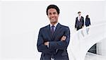 Portrait of smiling businessman on elevated walkway