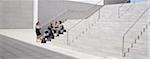 Business people meeting on concrete steps