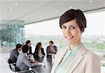 Portrait of smiling businesswoman in conference room