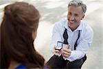 Man with engagement ring proposing to woman