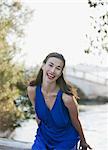 Portrait of laughing woman with canal in background