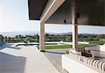 Luxury patio overlooking swimming pool and mountains