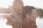 Close up of serene couple swimming in lake