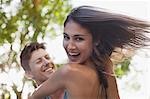 Close up of man spinning smiling girlfriend
