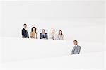 Portrait of confident business people standing on modern stairway