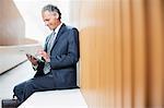 Businessman using digital tablet in office