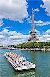 Bateaux Mouches tour boat on River Seine passing the Eiffel Tower, Paris, France, Europe