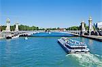 River Seine Cruise boat, Bateaux Mouches and the Pont Alexandre III Bridge, Paris, France, Europe