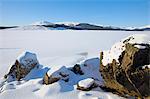 Clatteringshaws Loch, frozen and covered in winter snow, Dumfries and Galloway, Scotland, United Kingdom, Europe