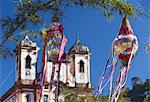 Decorations for festival with Our Lady of Conceicao de Antonio Dias Church in background, Ouro Preto, UNESCO World Heritage Site, Minas Gerais, Brazil, South America