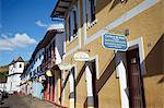 Row of shops and Catedral Basilica da Se, Mariana, Minas Gerais, Brazil, South America