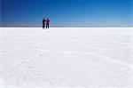 Couple taking photos on Salar de Uyuni (Salt Flats of Uyuni), Potosi Department, Bolivia, South America