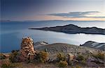 Stack of prayer stones on Isla del Sol (Island of the Sun), Lake Titicaca, Bolivia, South America