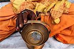 Holy man begging outside a temple, Vrindavan, Uttar Pradesh, India, Asia