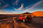 Hummer jeep on the Slickrock Trail at sunset, Moab, Utah, United States of America, North America