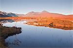 Lochan na h-Achlaise reflecting the surrounding mountains on Rannoch Moor, a Site of Special Scientific Interest, Scotland, United Kingdom, Europe