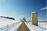 Tower with Power Lines and Rural Road in Winter, near Villingen-Schwenningen, Baden-Wuerttemberg, Germany