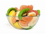 Fruit salad with citrus in a glass bowl on a white background