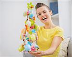 Happy young woman with Easter decoration