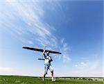 Man launches into the sky RC glider, wide-angle