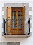 The Renovated Facade of the Old Spanish House with Balcony