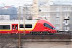 Speeding train taking commuters away from Warsaw, Poland