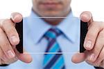 Businessman with modern technology gadget - transparent smartphone, closeup