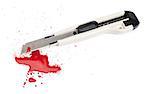 A blood covered boxcutter and spatter of blood isolated on a white background.