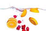 Fresh Fruit Falls under Water with a Splash, isolated