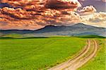 Farmhouse and Green Sloping Meadows of Tuscany, Sunset