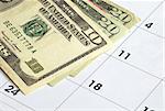 Money on a calendar concepts of financial planning