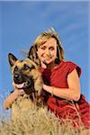 Portrait of Woman with German Shepherd Dog Outdoors