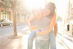 Couple Outdoors, Man Piggybacking Woman, Portland, Oregon, USA