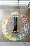 Businessman laying with paint swatches