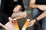 Business people examining paint swatches