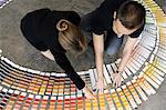 Business people examining paint swatches