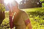 Woman talking on cell phone in park