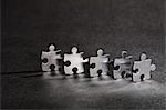 Close up of metal jigsaw pieces