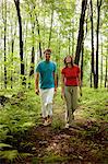 Couple walking in forest