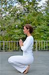 Woman practicing yoga outdoors