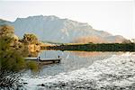 Wooden pier on still rural lake