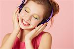 Girl in colorful makeup and headphones