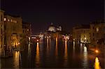 City lights reflected in urban canal