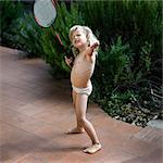 Girl playing badminton in underwear