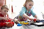 Children playing with shapes on table