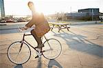 Man riding bicycle on city street