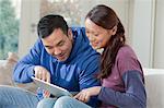 Couple using tablet computer together