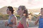 Friends running on beach