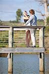 Couple smiling on wooden deck