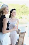 Women drinking wine together outdoors